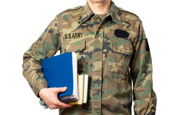 istock student soldier with books in hand 1390646397
