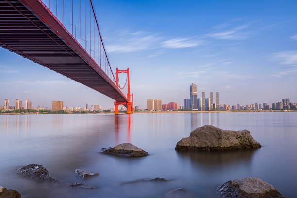 istock Wuhan Yingwuzhou Bridge under sky 1390649152