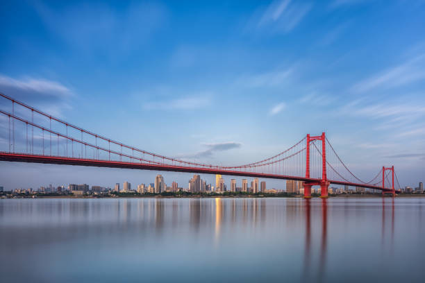 istock Wuhan Yingwuzhou Bridge under sky 1390649160