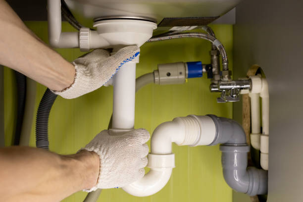 istock male hands twist the drain pipe under the sink in the kitchen 1390650177