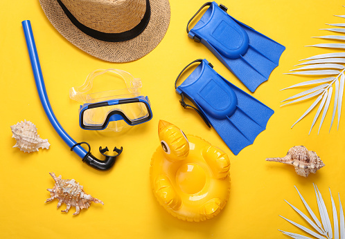 Composition with beach objects on yellow background. Top view. Flat lay. Sea vocation