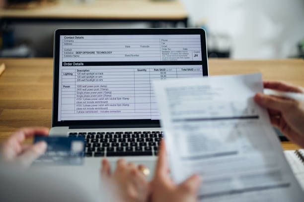 istock Unrecognizable Couple Paying Bills at Home 1390654897
