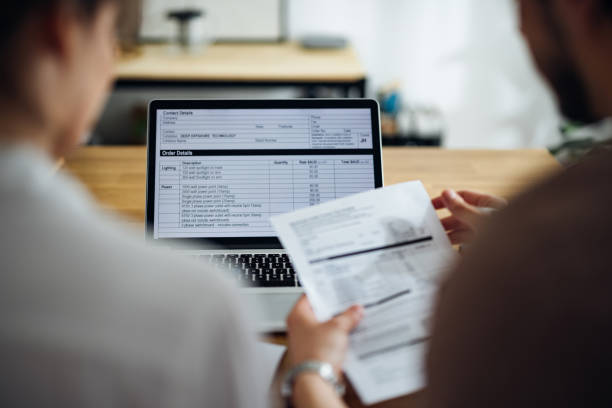 istock Unrecognizable Couple Paying Bills at Home 1390654898