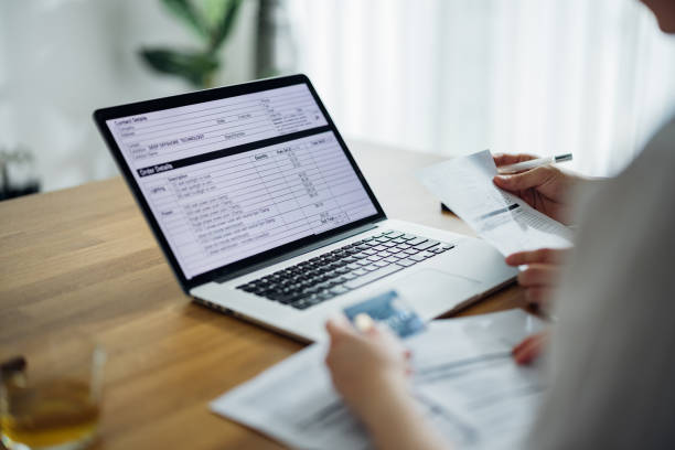 istock Unrecognizable Couple Paying Bills at Home 1390654902