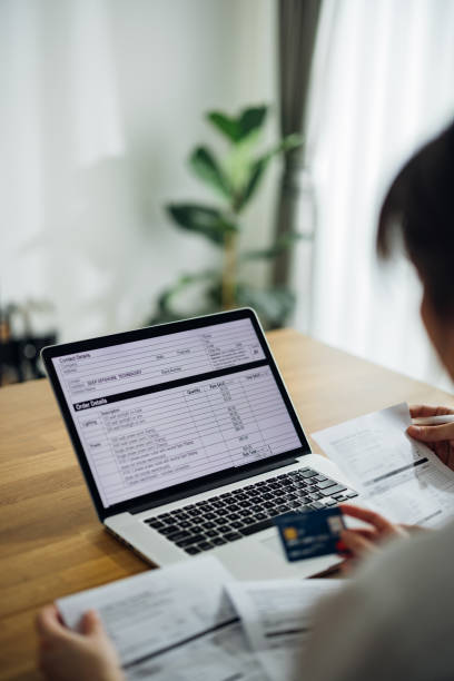 istock Unrecognizable Couple Paying Bills at Home 1390654903