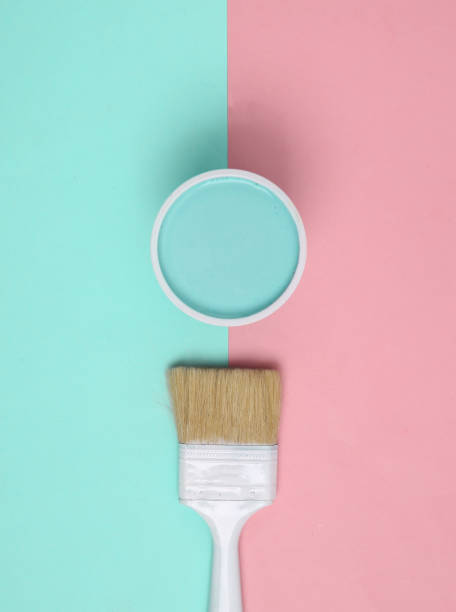 istock Paint Can with paintbrush on pink blue background. Top view 1390654914
