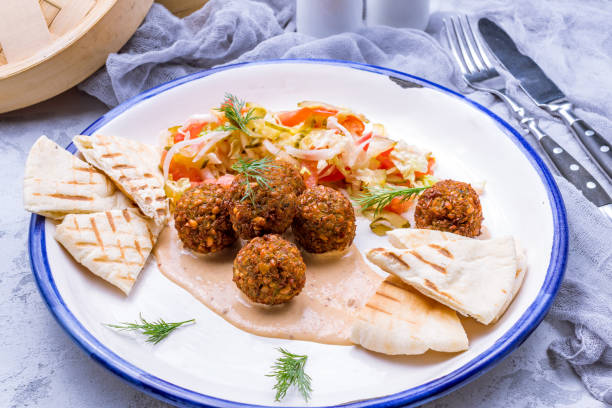 istock hummus with falafel balls on plate side view 1390655546