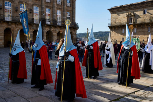 Nazarenes. Santiago de Compostela (April 9, 2022). Holy Week is one of the most solemn celebrations in Spain. The Nazarenes or brotherhoods walk the streets hooded with hoods carrying religious images. snake hood stock pictures, royalty-free photos & images