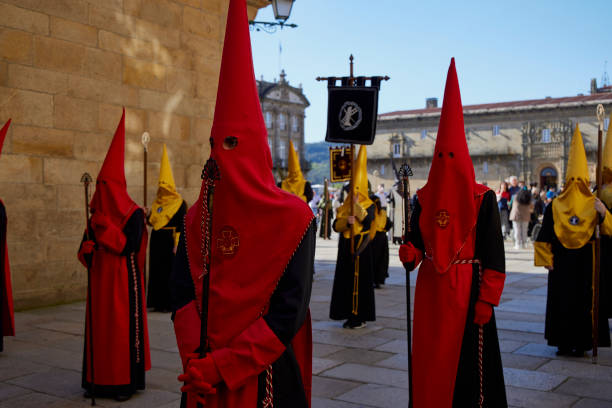 Nazarenes. Santiago de Compostela (April 9, 2022). Holy Week is one of the most solemn celebrations in Spain. The Nazarenes or brotherhoods walk the streets hooded with hoods carrying religious images. snake hood stock pictures, royalty-free photos & images