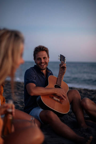 istock Playing guitar for friends 1390662187