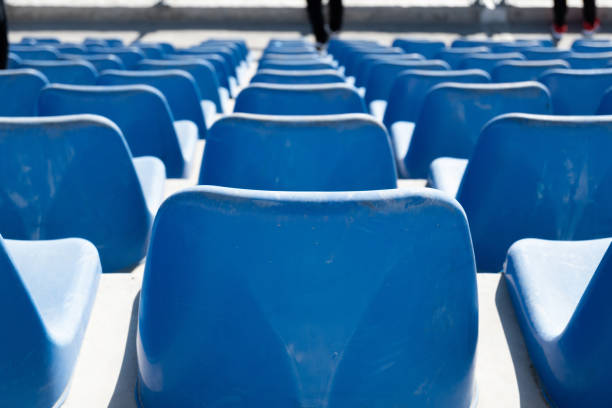 istock Rows of blue seats in a stadium . 1390662571
