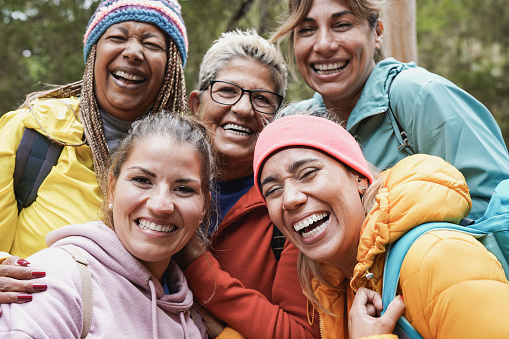 Multiracial women having fun taking a selfie during  trekking day - Multi generational people enjoy day in nature