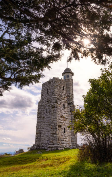 istock Tall stone tower being framed by foliage. Sky Top Tower, Mohonk New York 1390664648