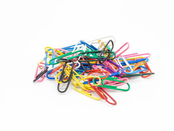 istock Colorful paper clips isolated on white background 1390665266