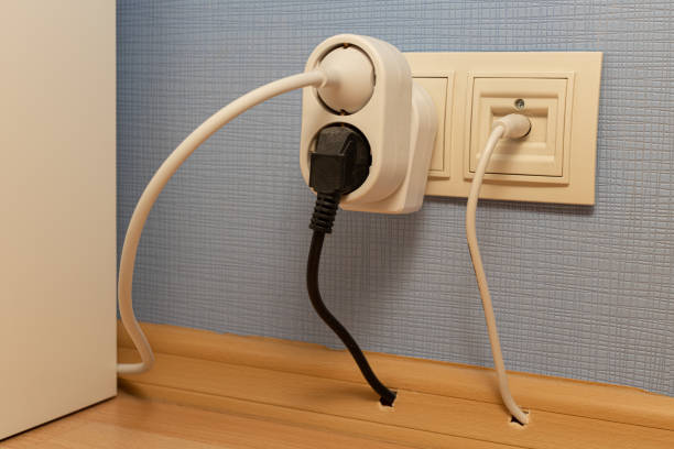 istock socket into which a tee and a power cord are plugged 1390668695