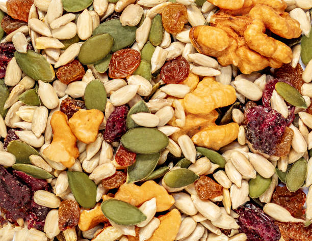 istock Nuts and seeds as a  background. Pattern  of granola or muesli Top view 1390669550