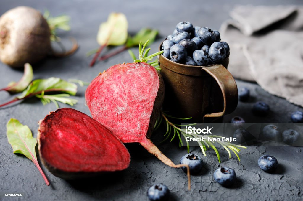Beetroot And Blueberries Fresh beetroot and blueberries with herbs. Antioxidant Stock Photo