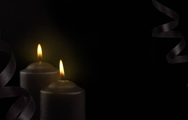 Candle and candlelight with skull in dimlight Halloween night / Select focus