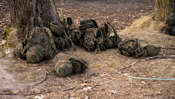 istock military backpacks lying on the ground 1390670007