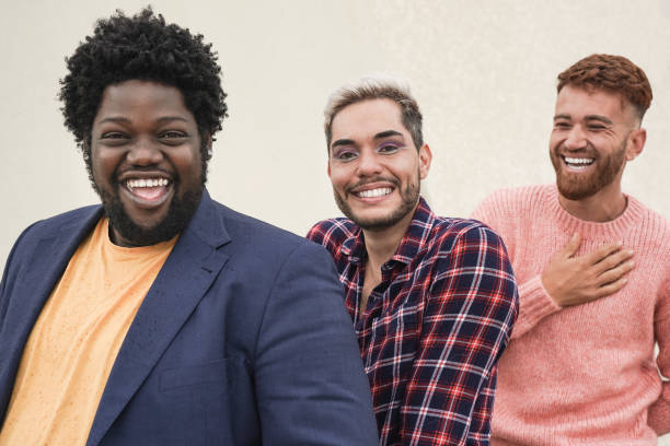 Happy diverse men laughing on camera outdoor - Multiracial friendship concept Happy diverse men laughing on camera outdoor - Multiracial friendship concept black men with blonde hair stock pictures, royalty-free photos & images