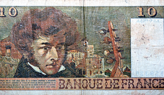 Large fragment of the reverse side of 10 ten French cent francs banknote currency by Bank of France features portrait of Louis Hector Berlioz, old French money, vintage retro, uncirculated