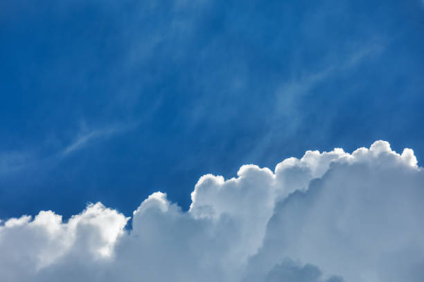 blue sky with silver lining cloud - every cloud has a silver lining imagens e fotografias de stock
