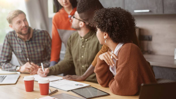 istock group of employees discussing financial documents . close-up 1390672800