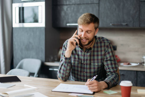 istock business man sitting at a table in a coworking center 1390673372