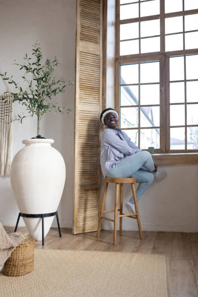 istock African woman in light clothes spending time at home 1390674352