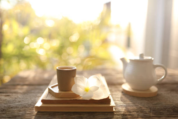 Wooden tea cup and white tea pot
