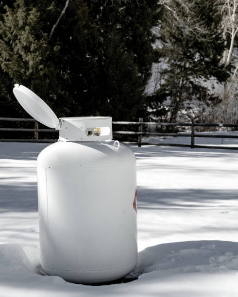 istock White propane tank in winter with lid open for maintenance 1390679048