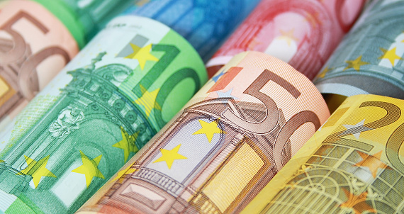Lots of different Euro banknotes shown as a mess