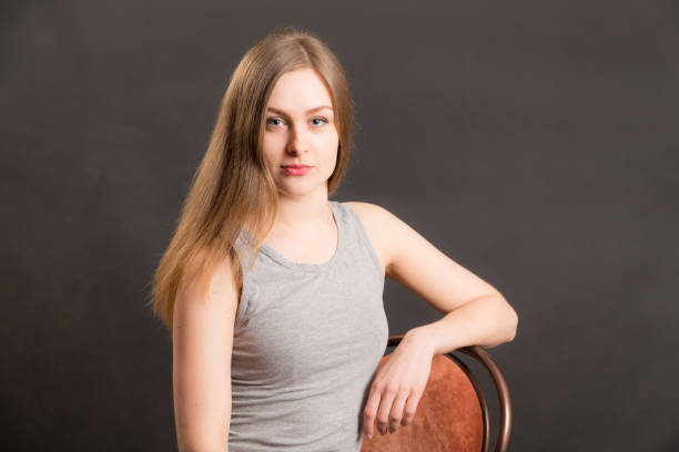 studio portrait of a girl with long hair on a black background