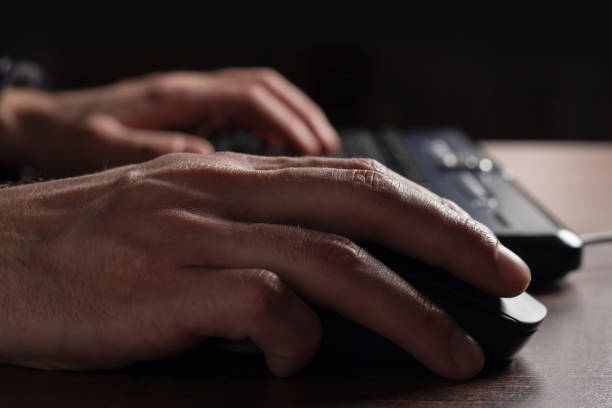 istock Human hand on computer mouse. Business, education, people and technology concept 1390680269