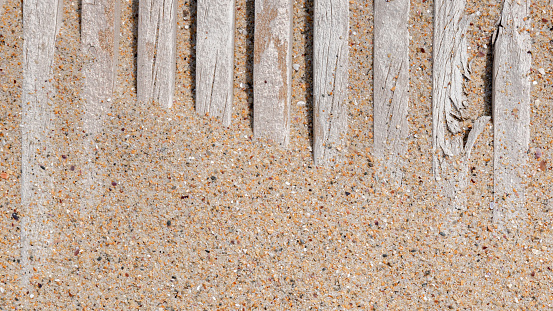 Macro background of beach sand and wood on boards