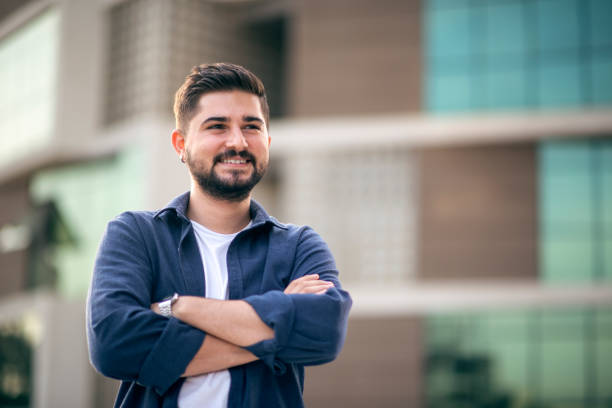 istock Portrait of casual smiling young man 1390682243