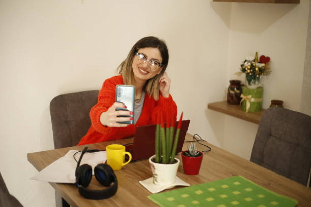 istock Young woman works from home 1390683342