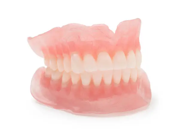 Dental new modern dentures isolated on white. Side view.