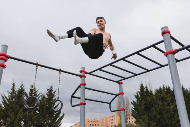 istock Young man practicing calisthenics outdoor. 1390690403