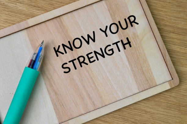 istock Wooden board written with text KNOW YOUR STRENGTH. 1390694418