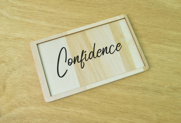 istock Top view of wooden board written with text CONFIDENCE. 1390695571