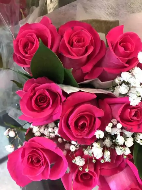 pink roses bouquets at supermarket