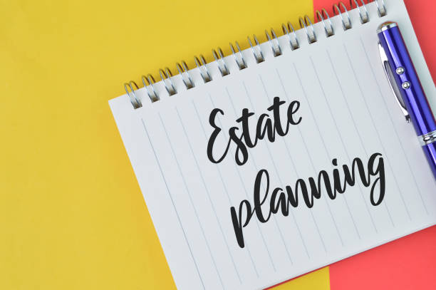 istock Notebook written with text ESTATE PLANNING over red and yellow background. 1390696650