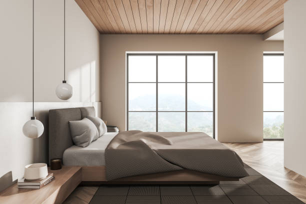 istock Light bedroom interior with bed on carpet, panoramic window with countryside 1390697256