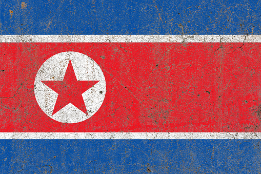 Flag of north korea on a distressed old rustic concrete wall