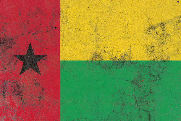 Small paper flag of Ghana pinned. Isolated on white background. Horizontal orientation. Close up photography. Copy space.