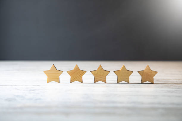 istock Wooden five star shape on table 1390698216