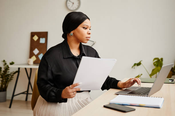 istock Successful Black Businesswoman at Desk 1390702873
