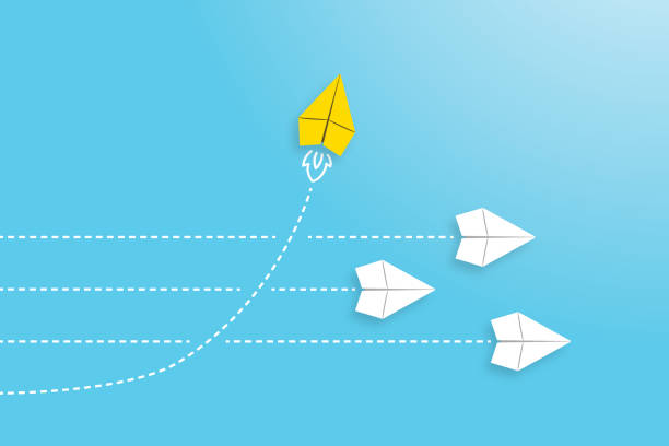 istock Change concepts with yellow paper airplane leading among white 1390705624
