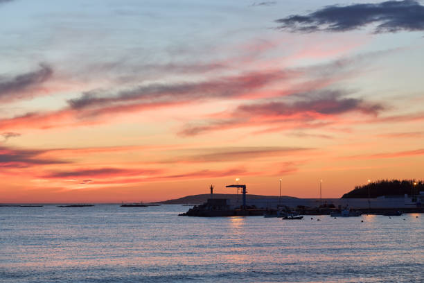 Fishing port silhouette at sunset.